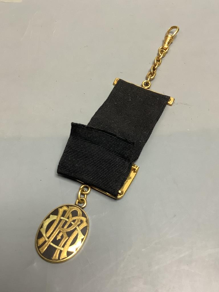 A Japanese komai style gold and silver damascened iron watch fob circa 1900
